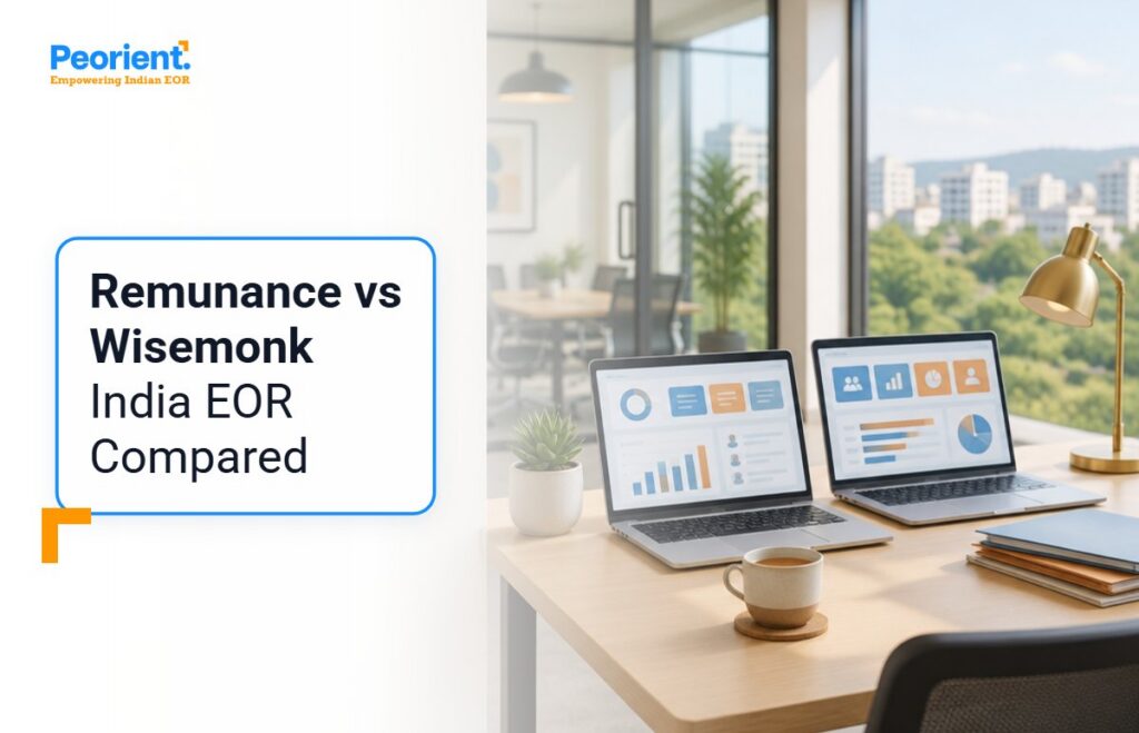 Indian office desk with two laptops showing HR dashboards, for a Remunance vs Wisemonk India EOR comparison